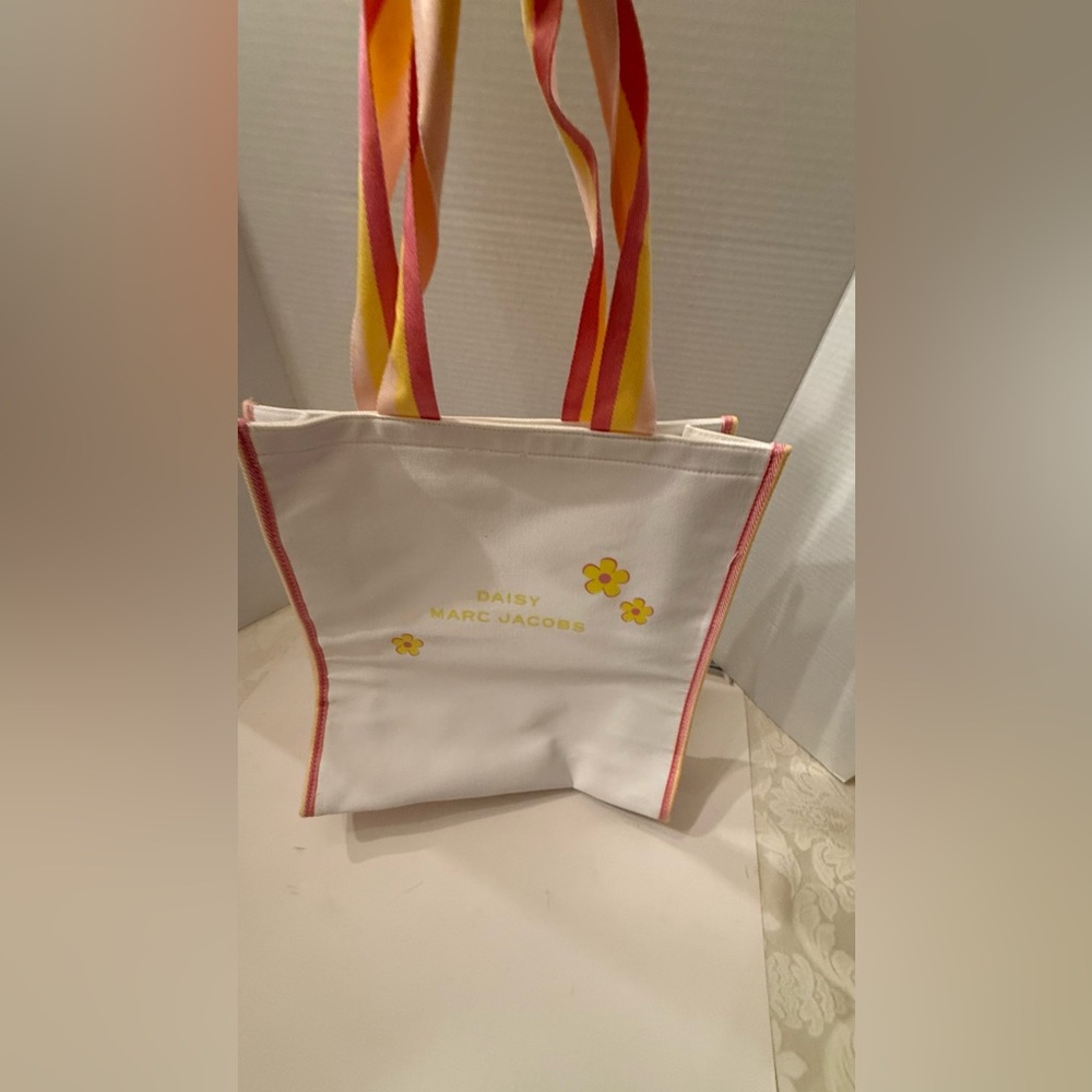 Marc Jacobs White Tote with floral designs and with colorful stipe Straps NEW